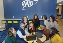 Developing talent drives AAA Northeast forward ADVANCING CAREERS: Staff members at AAA Northeast gather at the company’s Providence office. A year ago, AAA Northeast launched a career exploration program that provides a learning platform for employees of diverse backgrounds and talents who are performing well in their current roles.
PBN PHOTO/ELIZABETH GRAHAM