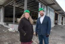 SHERI GRIFFIN, co-executive director of Farm Fresh Rhode Island standing with co-executive director Jesse Rye, co-executive directors of Farm Fresh Rhode Island, at the construction site for their new 60,000 square foot Food Hub facility in 2020, announced Tuesday she is stepping away from the organization next month. Rye in 2023 will become Farm Fresh' sole executive director. /PBN FILE PHOTO/MICHAEL SALERNO