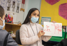 Rhode Island Foundation is investing in creating a stronger community HEAD OF THE CLASS: The Rhode Island Foundation recently launched a college loan repayment program to help the Providence Public School District recruit and retain teachers of color. One participant is Maria Taveras, pictured, who is working on a math lesson with her second grade class at Fortes Lima Elementary School.
COURTESY RHODE ISLAND FOUNDATION