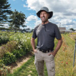 FULFILLED FARMER: Christopher Clegg, a fifth-generation co-owner of his family’s Four Town Farm in Seekonk, used to dream of being an architect until he decided to step up to continue running the family business, a job he now relishes and is passionate about.  PBN PHOTO/RUPERT WHITELEY