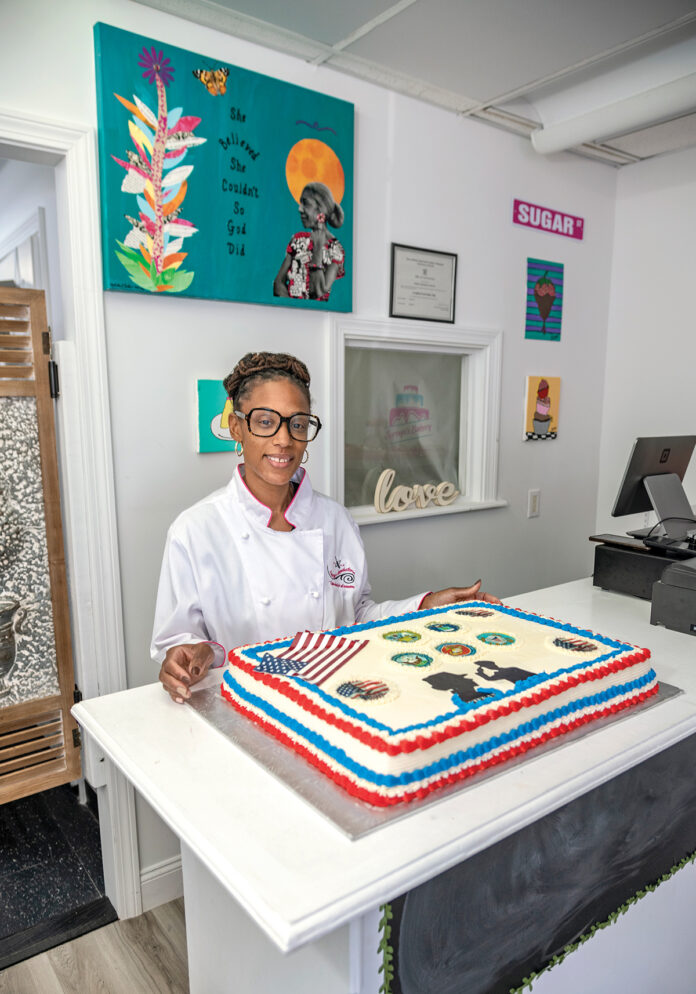 PERSONAL TOUCH: Syroya Eugene, owner of Syroya’s Bakery in North Providence, with a cake she made honoring veterans.
PBN PHOTO/MICHAEL SALERNO PERSONAL TOUCH: Syroya Eugene, owner of Syroya’s Bakery in North Providence, with a cake she made honoring veterans.
PBN PHOTO/MICHAEL SALERNO