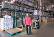 TAKING STOCK: Rhode Island Community Food Bank Chief Philanthropy Officer Lisa Roth Blackman says empty shelves are a common sight at the organization’s Providence warehouse because demand is so high lately.  PBN PHOTO/MICHAEL SALERNO