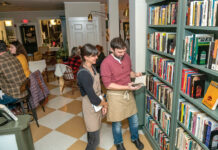 Used bookstore and bar business building its own community in Warren LOVE OF LITERATURE: Uriah Donnelly, right, realized his dream of owning a bookstore when he and his wife, Janet Moscarello, left, opened arc{hive} book + snackery in Warren in June.
PBN PHOTO/MICHAEL SALERNO