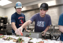 Food banks, pantries across R.I. report surging need REACHING OUT: LaSalle Academy students JJ Sanzi, left, and Cole Matthews volunteer by preparing meals at the Amos House food kitchen in Providence.
PBN PHOTO/MICHAEL SALERNO