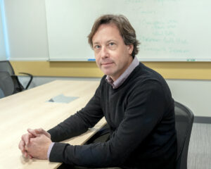 UNWELCOME FEELING: Erik Christiansen, Rhode Island College history professor and faculty union president, says the college has undergone changes in the last decade, not all for the better. PBN PHOTO/MICHAEL SALERNO