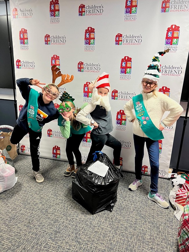 GIRL SCOUTS from Troop 723 in Barrington collected items for a local family in need as part of the Scouts’ initiative to serve the community during the holidays. / COURTESY GIRL SCOUTS OF SOUTHEASTERN NEW ENGLAND