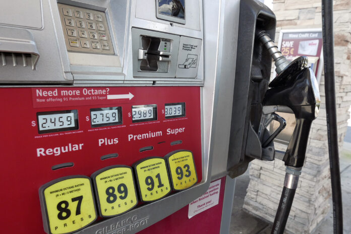 THE AVERAGE price of self-serve, regular unleaded gasoline in Rhode Island has dropped to $3.32 per gallon on Monday, according to AAA Northeast. / AP FILE PHOTO/JOHN RAOUX