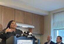 MICHELLE LEE, left, speaks during Thursday's press event cutting the ribbon-cutting event on new homeless family apartments in Warwick for Crossroads Rhode Island. Lee will become a new resident in the apartments. Also pictured are R.I. Housing Secretary Stefan Pryor, middle, and House Speaker K. Joseph Shekarchi, D-Warwick. / COURTESY CROSSROADS RHODE ISLAND