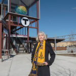 RENEWED INTEREST: Pawtucket Foundation Executive Director Jan A. Brodie stands in front of the Pawtucket-Central Falls Transit Center, which has been attracting residential and commercial development interest to the area since opening on Jan. 23.  PBN PHOTO/MICHAEL SALERNO