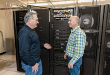 From design to contracts, companies embrace AI tools DATA CENTER: Ocean State Job Lot Chief Information Officer Hisham Aharon, left, and Chief Financial Officer John Conforti inspect the computer servers that power the retailer’s technology, including the artificial intelligence software it uses.
PBN PHOTO/TRACY JENKINS