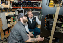 Creative Conners’ products keep stages moving for small theaters, productions CLOSER LOOK: Creative Conners Inc. owner and CEO Gareth Conners, right, inspects a piece of equipment with automation technician Stephen “Bo” Bogev at the manufacturer’s Warren facility.
PBN PHOTO/TRACY JENKINS