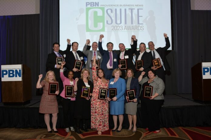 HONOREES AND HONOREE REPRESENTATIVES pose with their Providence Business News 2023 C-Suite Awards following Thursday's awards event at the Omni Providence Hotel. / PBN PHOTO/MIKE SKORSKI
