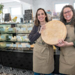 FILLING A VOID: Wedge co-owners Sasha Goldman, left, and Chelsea Morrissey opened their cheese shop in Warren after noticing limited artisan cheese options in the area.  PBN PHOTO/MICHAEL SALERNO