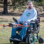 SKY’S THE LIMIT: Drone Ability Inc. owner Kraig Mitchell, who has muscular dystrophy and is confined to a power wheelchair, says flying drones has allowed him to rediscover his freedom and independence.  PBN PHOTO/MICHAEL SALERNO