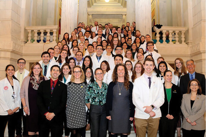  Staffers and students from the University of Rhode Island College of Pharmacy gather at the R.I. Statehouse.  COURTESY UNIVERSITY  OF RHODE ISLAND