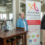 WAVE OF GROWTH: Since buying Allegra, a full-service printing, mailing and marketing company in Providence, in 2017, Bud and Karen McCann have quadrupled the revenue and tripled the size of the staff of the more than 50-year-old shop.  PBN PHOTO/MICHAEL SALERNO