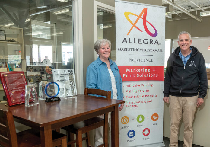 WAVE OF GROWTH: Since buying Allegra, a full-service printing, mailing and marketing company in Providence, in 2017, Bud and Karen McCann have quadrupled the revenue and tripled the size of the staff of the more than 50-year-old shop.  PBN PHOTO/MICHAEL SALERNO