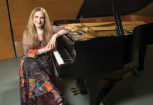 RIC’s Stillman uses music to inspire, unite the community GOING GLOBAL: Judith Lynn Stillman, Rhode Island College’s artist-in-residence and music professor, traveled in 2016 to Greece to play music as a way to aid the Syrian refugee crisis.
PBN PHOTO/DAVID HANSEN