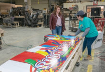 Unexpected turns in Beck’s career lead to being all in the family DYNAMIC LEADER: Tracey Beck, left, co-owner and chief operating officer of The Beck Cos. in North Smithfield, speaks with cabinet assembler Ruth Gomez.
PBN FILE PHOTO/MICHAEL SALERNO