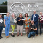 PET PROTECTORS: A group of Carey, Richmond & Viking Insurance employees visit the Potter League for Animals in Middletown.  COURTESY CAREY, RICHMOND & VIKING INSURANCE