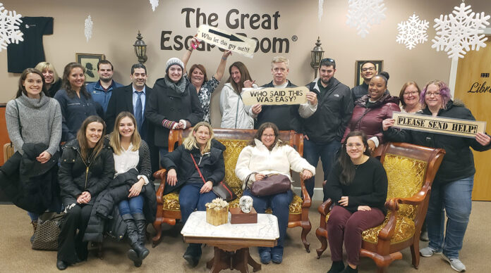 SUPER SLEUTHING: The staff at Citrin Cooperman & Co. LLP participate in an escape room activity.  COURTESY CITRIN COOPERMAN & CO. LLP