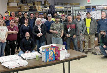 Connectivity Point Design & Installation FAST FOOD: Employees at Connectivity Point Design & Installation LLC enjoy a pizza lunch at the office.
COURTESY CONNECTIVITY POINT DESIGN & INSTALLATION LLC