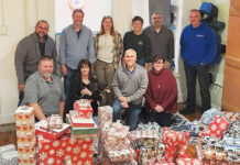 Envision Technology Advisors LLC SEASON OF GIVING: Envision Technology Advisors LLC employees wrap gifts during its annual Adopt A Family Wrapping Party.
COURTESY ENVISION TECHNOLOGY ADVISORS LLC