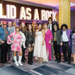 ROCKING OUT: Amgen Rhode Island employees dress up for its Solid As A Rock 1980s-themed gala.  COURTESY AMGEN RHODE ISLAND