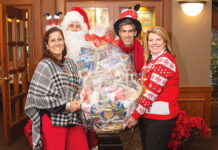 Amica Mutual Insurance Co. HOLIDAY GIVING: Amica Mutual Insurance Co. employees, with an assist from Santa, continue a tradition of holiday giving with a Penny Social, which raised more than $7,000 to benefit Meals on Wheels of Rhode Island.
COURTESY AMICA MUTUAL INSURANCE CO.