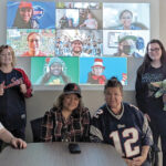 SHOWING SOME SPIRIT: Rhode Island Parent Information Network Inc. employees dress in sporting attire both in the office and virtually.  COURTESY RHODE ISLAND PARENT INFORMATION NETWORK INC.