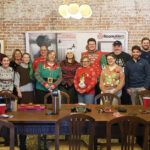 DRESSED UP: Some AVTECH Software Inc. staff members enjoy a holiday potluck and Ugly Sweater contest.  COURTESY AVTECH SOFTWARE INC.