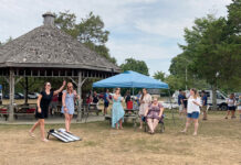 Sansiveri, Kimball & Co. LLP SUMMERTIME: Sansiveri, Kimball & Co. LLP team members relax with lawn games and enjoy the sun at the company’s annual summer outing at Goddard Memorial State Park in Warwick.
COURTESY SANSIVERI, KIMBALL & CO. LLP