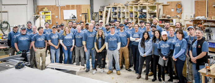 BUILDING THEIR SKILLS: Sweenor Builders Inc. team members pose for a photo after a training session in its custom millwork shop.  COURTESY SWEENOR BUILDERS INC.