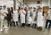 The Town Dock HATS OFF: Staffers at The Town Dock wear new company hats at the company’s facility.
COURTESY THE TOWN DOCK