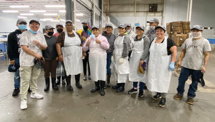 HATS OFF: Staffers at The Town Dock wear new company hats at the company’s facility.
COURTESY THE TOWN DOCK HATS OFF: Staffers at The Town Dock wear new company hats at the company’s facility.
COURTESY THE TOWN DOCK