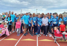 Westerly Community Credit Union SUPPORTING ANTHONY: Westerly Community Credit Union employees participate in a Belly Button 5K Walk, an event created by one of its employees and his wife in memory of their son, Anthony, who died due to a rare birth defect.
COURTESY WESTERLY COMMUNITY CREDIT UNION