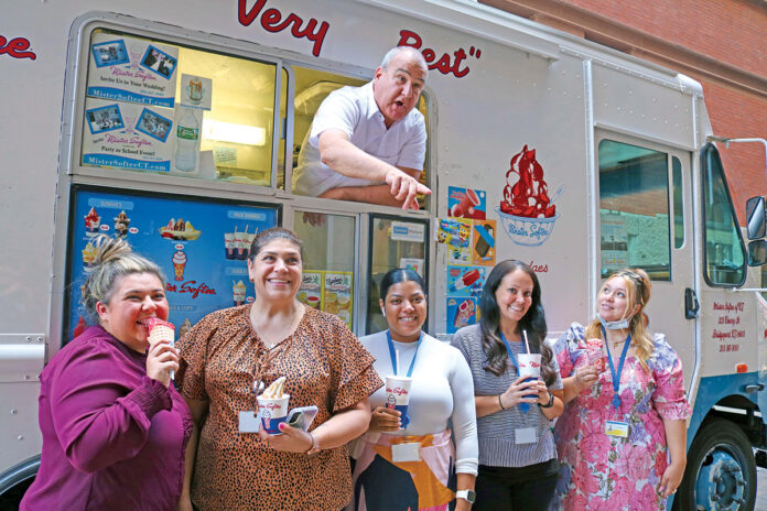 TASTY TREATS: Staff members from the R.I. Housing and Mortgage Finance Corp. enjoy ice cream as part of the institution’s Ice Cream Social.
COURTESY R.I. HOUSING AND MORTGAGE FINANCE CORP. TASTY TREATS: Staff members from the R.I. Housing and Mortgage Finance Corp. enjoy ice cream as part of the institution’s Ice Cream Social.
COURTESY R.I. HOUSING AND MORTGAGE FINANCE CORP.
