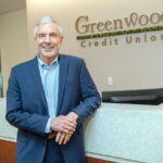 IN THE DRIVER’S SEAT: Frederick Reinhardt, CEO and president of Greenwood Credit Union, says more people were turning to Greenwood and other credit unions for auto loans as interest rates changed over the last year.  PBN PHOTO/­MICHAEL SALERNO