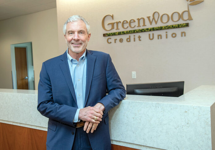 IN THE DRIVER’S SEAT: Frederick Reinhardt, CEO and president of Greenwood Credit Union, says more people were turning to Greenwood and other credit unions for auto loans as interest rates changed over the last year.  PBN PHOTO/­MICHAEL SALERNO