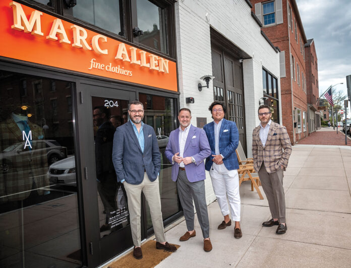 ALWAYS AVAILABLE: At Marc Allen Fine Clothiers in Providence, one of the team members is always available to help customers. Standing from left are Colin Ward, store manager; Marc Streisand, owner; Will Arvanites, director of operations; and Josh Jacob, director of tailored clothing.  PBN PHOTO/MICHAEL SALERNO