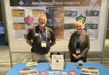 Custom Computer Specialists Inc. ON DISPLAY: Custom Computer Specialists Inc. employees Mason Sock and Suzanne McLaughlin stand at a station promoting the company at an event.
COURTESY CUSTOM COMPUTER SPECIALISTS INC.