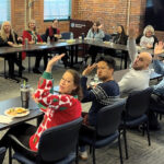 LUNCHTIME: Healthcentric Advisors Inc. holds a holiday lunch at the ­office.  COURTESY HEALTHCENTRIC ADVISORS INC.