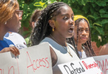 SPEAKING OUT: Zainabou Thiam, center, a student at the MET School in Providence, speaks at a rally at Brown University on July 8 organized by the Black Lives Matter Rhode Island political action committee. The rally sought to end legacy admissions and support diversity and equity in universities.  PBN PHOTO/MICHAEL SALERNO