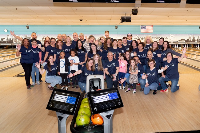 EMPLOYEES AND FAMILY members from Bank Rhode Island participate in Junior Achievement of Rhode Island’s Achieve-A-Bowl fundraiser, part of the nonprofit’s “Play4JA” initiative, at Lang’s Bowlarama Inc. in Cranston. / COURTESY JUNIOR ACHIEVEMENT OF RHODE ISLAND