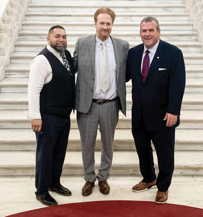 CIVIC LEADERSHIP: John Healy, center, a teacher at E-Cubed Academy in Providence, was recently named the inaugural winner of the Rhode Island Civic Education Teacher of the Year award. He is pictured with Providence Public School Superintendent Javier Montañez, left, and R.I. Secretary of State Gregg Amore.
COURTESY PROVIDENCE PUBLIC SCHOOL DISTRICT CIVIC LEADERSHIP: John Healy, center, a teacher at E-Cubed Academy in Providence, was recently named the inaugural winner of the Rhode Island Civic Education Teacher of the Year award. He is pictured with Providence Public School Superintendent Javier Montañez, left, and R.I. Secretary of State Gregg Amore.
COURTESY PROVIDENCE PUBLIC SCHOOL DISTRICT
