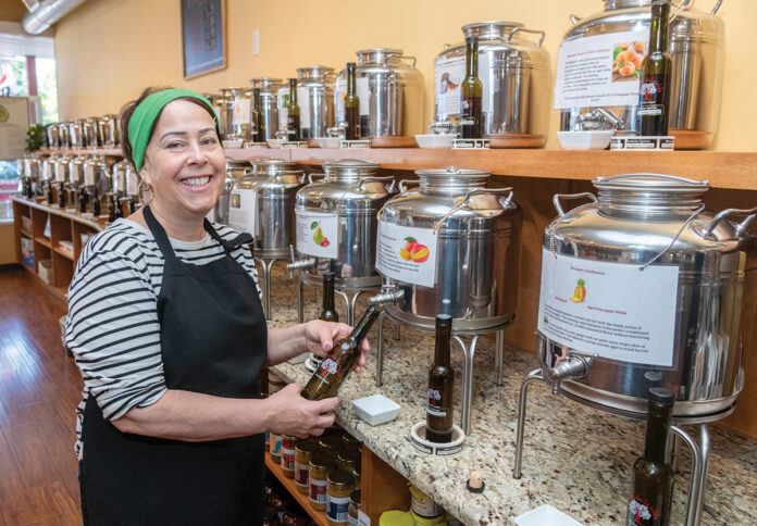 TASTE MASTER: Nectar de la Vida owner Maureen Botelho has more than 100 tanks of olive oil and balsamic vinegars that are of better quality than most products found in larger grocery stores.
PBN PHOTO/MICHAEL SALERNO TASTE MASTER: Nectar de la Vida owner Maureen Botelho has more than 100 tanks of olive oil and balsamic vinegars that are of better quality than most products found in larger grocery stores.
PBN PHOTO/MICHAEL SALERNO
