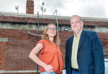 Olneyville’s free internet narrows digital divide CONNECTORS: Jennifer Hawkins, left, CEO and president of the nonprofit ONE Neighborhood Builders, and David Marble, CEO and president of OSHEAN Inc., check new network antennae on the roof of ONE Neighborhood Builders’ Providence headquarters. The antennae are helping to provide free Wi-Fi to residents in the Olneyville neighborhood.
PBN PHOTO/MICHAEL SALERNO