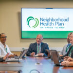 ROUNDTABLE: Neighborhood Health Plan of Rhode Island CEO and President Peter Marino, center, meets with staff at the health insurer’s Smithfield headquarters. PBN PHOTO/­MICHAEL SALERNO