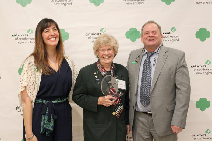 FAMED SCOUT: Nancy Armstrong, center, is presented with the inaugural Hall of Fame award from the Girl Scouts of Southeastern New England. Pictured with Armstrong are Girl Scouts CEO Dana Borrelli-Murray, left, and Girl Scouts Director of Properties and Facilities William Webster.  COURTESY GIRL SCOUTS OF  SOUTHEASTERN NEW ENGLAND