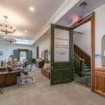 PRESERVING HISTORY: The main office area at Cetrulo LLP in Providence contains new equipment, as well as restored millwork, doors and chandeliers.  PBN PHOTO/MICHAEL SALERNO